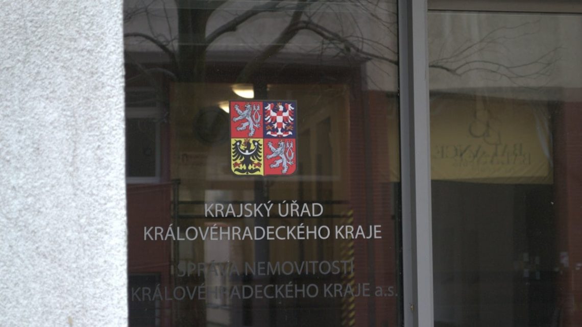 Sign on glass door for regional office.