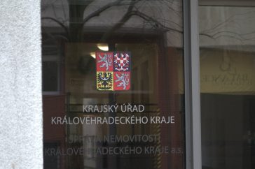 Sign on glass door for regional office.